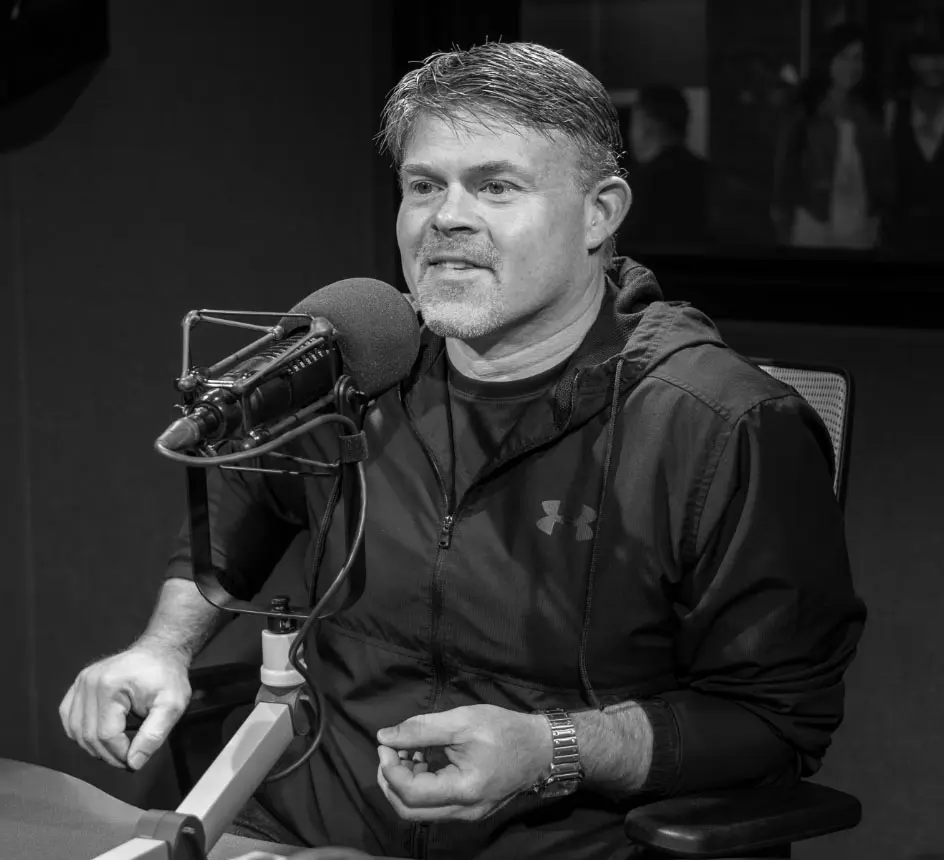 Jon Hicks behind Microphone